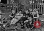Image of man under a tree Kentucky United States USA, 1940, second 5 stock footage video 65675050028