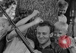 Image of man under a tree Kentucky United States USA, 1940, second 17 stock footage video 65675050028