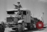 Image of British soldiers retrieve a disabled tank while being shelled North Africa, 1941, second 30 stock footage video 65675050209