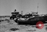 Image of British soldiers retrieve a disabled tank while being shelled North Africa, 1941, second 39 stock footage video 65675050209