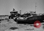Image of British soldiers retrieve a disabled tank while being shelled North Africa, 1941, second 40 stock footage video 65675050209