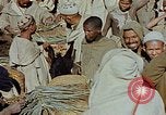 Image of snake charmer Marrakesh Morocco, 1942, second 22 stock footage video 65675050221