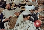 Image of snake charmer Marrakesh Morocco, 1942, second 25 stock footage video 65675050221