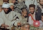 Image of snake charmer Marrakesh Morocco, 1942, second 29 stock footage video 65675050221