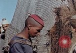 Image of snake charmer Marrakesh Morocco, 1942, second 56 stock footage video 65675050221