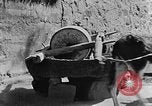 Standbild Dorf Schleifstein China, 1938, aus Sekunde 25 historischem Filmmaterial Videoclip 65675050387
