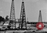 Image of Oil drilling derricks at various places in California Los Angeles California USA, 1925, second 9 stock footage video 65675050481