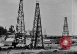 Image of Oil drilling derricks at various places in California Los Angeles California USA, 1925, second 10 stock footage video 65675050481