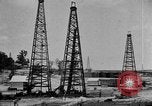 Image of Oil drilling derricks at various places in California Los Angeles California USA, 1925, second 11 stock footage video 65675050481