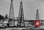 Image of Oil drilling derricks at various places in California Los Angeles California USA, 1925, second 13 stock footage video 65675050481