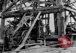 Image of Oil drilling derricks at various places in California Los Angeles California USA, 1925, second 18 stock footage video 65675050481