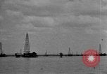 Image of Oil drilling derricks at various places in California Los Angeles California USA, 1925, second 53 stock footage video 65675050481