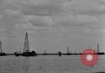 Image of Oil drilling derricks at various places in California Los Angeles California USA, 1925, second 54 stock footage video 65675050481