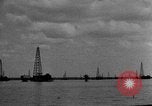 Image of Oil drilling derricks at various places in California Los Angeles California USA, 1925, second 57 stock footage video 65675050481