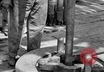 Image of Preparing an oil drilling bit and drilling for oil United States USA, 1925, second 35 stock footage video 65675050482