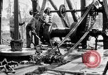 Image of Preparing an oil drilling bit and drilling for oil United States USA, 1925, second 36 stock footage video 65675050482