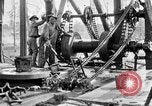 Image of Preparing an oil drilling bit and drilling for oil United States USA, 1925, second 37 stock footage video 65675050482