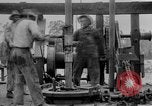 Image of Preparing an oil drilling bit and drilling for oil United States USA, 1925, second 49 stock footage video 65675050482