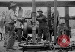 Image of Preparing an oil drilling bit and drilling for oil United States USA, 1925, second 50 stock footage video 65675050482