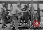 Image of Preparing an oil drilling bit and drilling for oil United States USA, 1925, second 51 stock footage video 65675050482