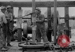 Image of Preparing an oil drilling bit and drilling for oil United States USA, 1925, second 52 stock footage video 65675050482