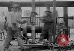 Image of Preparing an oil drilling bit and drilling for oil United States USA, 1925, second 53 stock footage video 65675050482