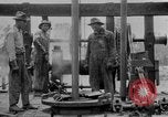 Image of Preparing an oil drilling bit and drilling for oil United States USA, 1925, second 55 stock footage video 65675050482