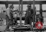 Image of Preparing an oil drilling bit and drilling for oil United States USA, 1925, second 56 stock footage video 65675050482