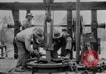Image of Preparing an oil drilling bit and drilling for oil United States USA, 1925, second 57 stock footage video 65675050482