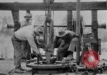 Image of Preparing an oil drilling bit and drilling for oil United States USA, 1925, second 58 stock footage video 65675050482