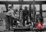 Image of Preparing an oil drilling bit and drilling for oil United States USA, 1925, second 59 stock footage video 65675050482