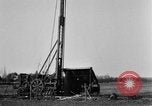 Image of "Shooting" an oil well with nitroglycerin United States USA, 1925, second 30 stock footage video 65675050483