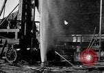 Image of "Shooting" an oil well with nitroglycerin United States USA, 1925, second 33 stock footage video 65675050483