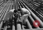 Image of oil pumping station Iran, 1951, second 8 stock footage video 65675050593