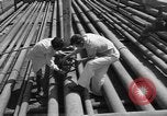 Image of oil pumping station Iran, 1951, second 10 stock footage video 65675050593