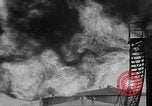 Image of oil fire Rotterdam Netherlands, 1954, second 10 stock footage video 65675050606