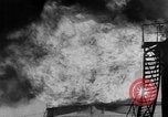 Image of oil fire Rotterdam Netherlands, 1954, second 11 stock footage video 65675050606