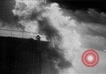 Image of oil fire Rotterdam Netherlands, 1954, second 23 stock footage video 65675050606