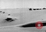 Image of caravan caught in a sand storm in desert of Saudi Arabia Saudi Arabia, 1936, second 22 stock footage video 65675050625