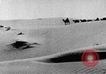 Image of caravan caught in a sand storm in desert of Saudi Arabia Saudi Arabia, 1936, second 23 stock footage video 65675050625