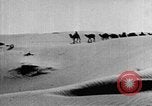 Image of caravan caught in a sand storm in desert of Saudi Arabia Saudi Arabia, 1936, second 27 stock footage video 65675050625