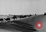 Image of caravan caught in a sand storm in desert of Saudi Arabia Saudi Arabia, 1936, second 54 stock footage video 65675050625