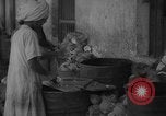 Image of shelling and drying of coconut Caracas Venezuela, 1940, second 1 stock footage video 65675050637