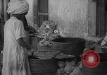Image of shelling and drying of coconut Caracas Venezuela, 1940, second 4 stock footage video 65675050637
