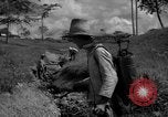 Image of man with container on his back Caracas Venezuela, 1940, second 14 stock footage video 65675050648