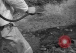 Image of man with container on his back Caracas Venezuela, 1940, second 50 stock footage video 65675050648
