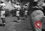 Image of Japanese teach semaphore signaling to Borneo natives Borneo, 1942, second 14 stock footage video 65675050779