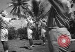 Image of Japanese teach semaphore signaling to Borneo natives Borneo, 1942, second 15 stock footage video 65675050779