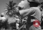Image of Japanese teach semaphore signaling to Borneo natives Borneo, 1942, second 16 stock footage video 65675050779