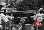 Image of Japanese teach semaphore signaling to Borneo natives Borneo, 1942, second 28 stock footage video 65675050779